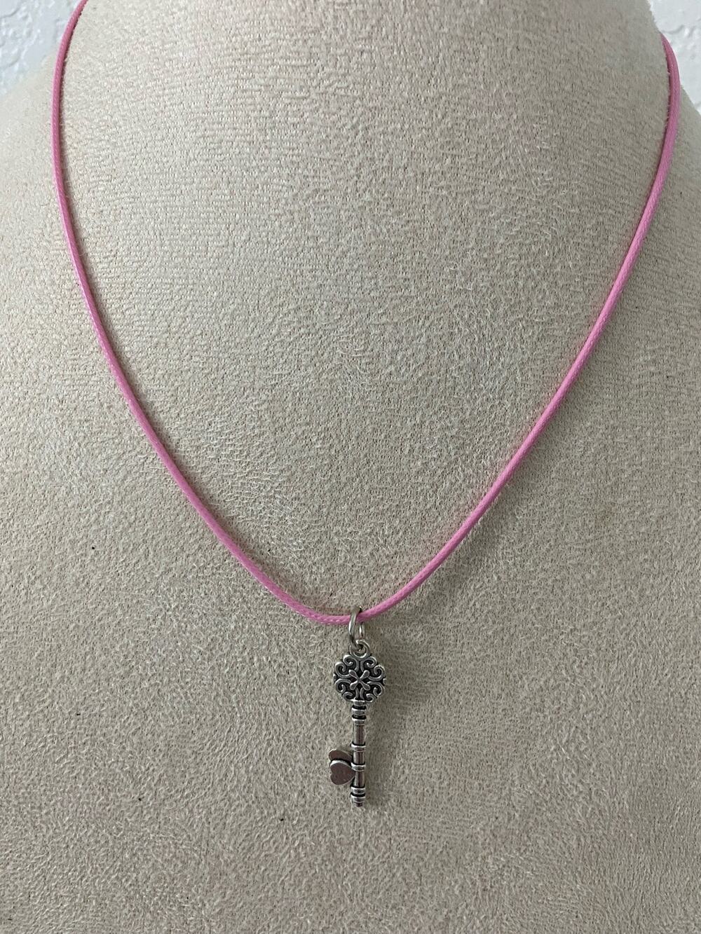 Silver tone key pendant necklace